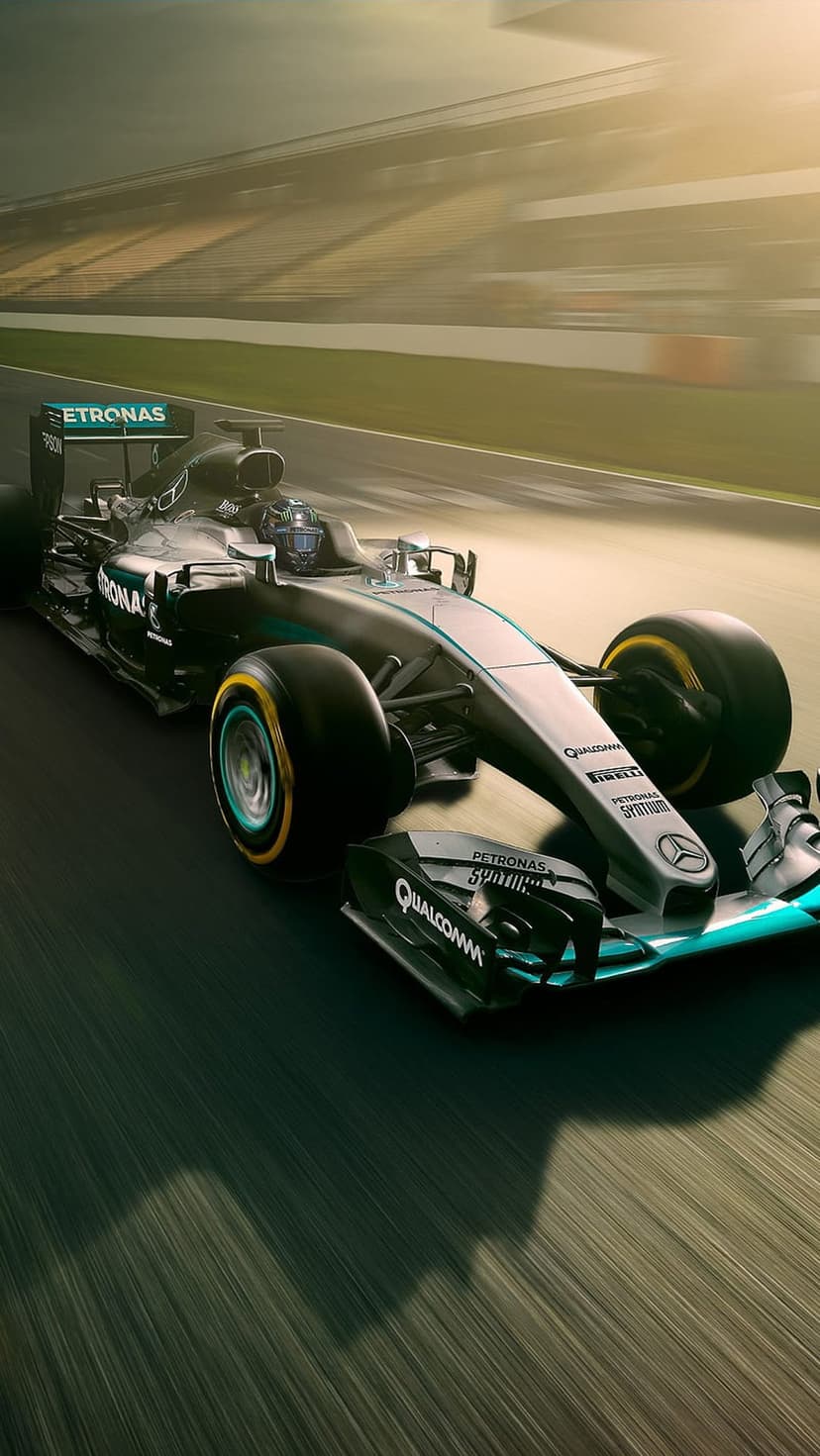 Mercedes F1 car racing at high velocity on a sun-drenched circuit with professional motion blur background.
