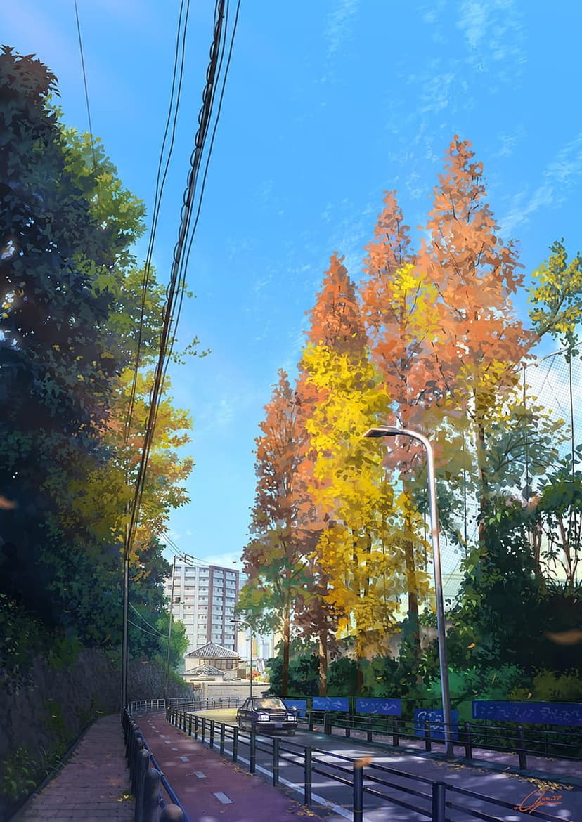 Golden autumn trees and a black metal fence border a sunlit city street under a clear blue sky with thin clouds.