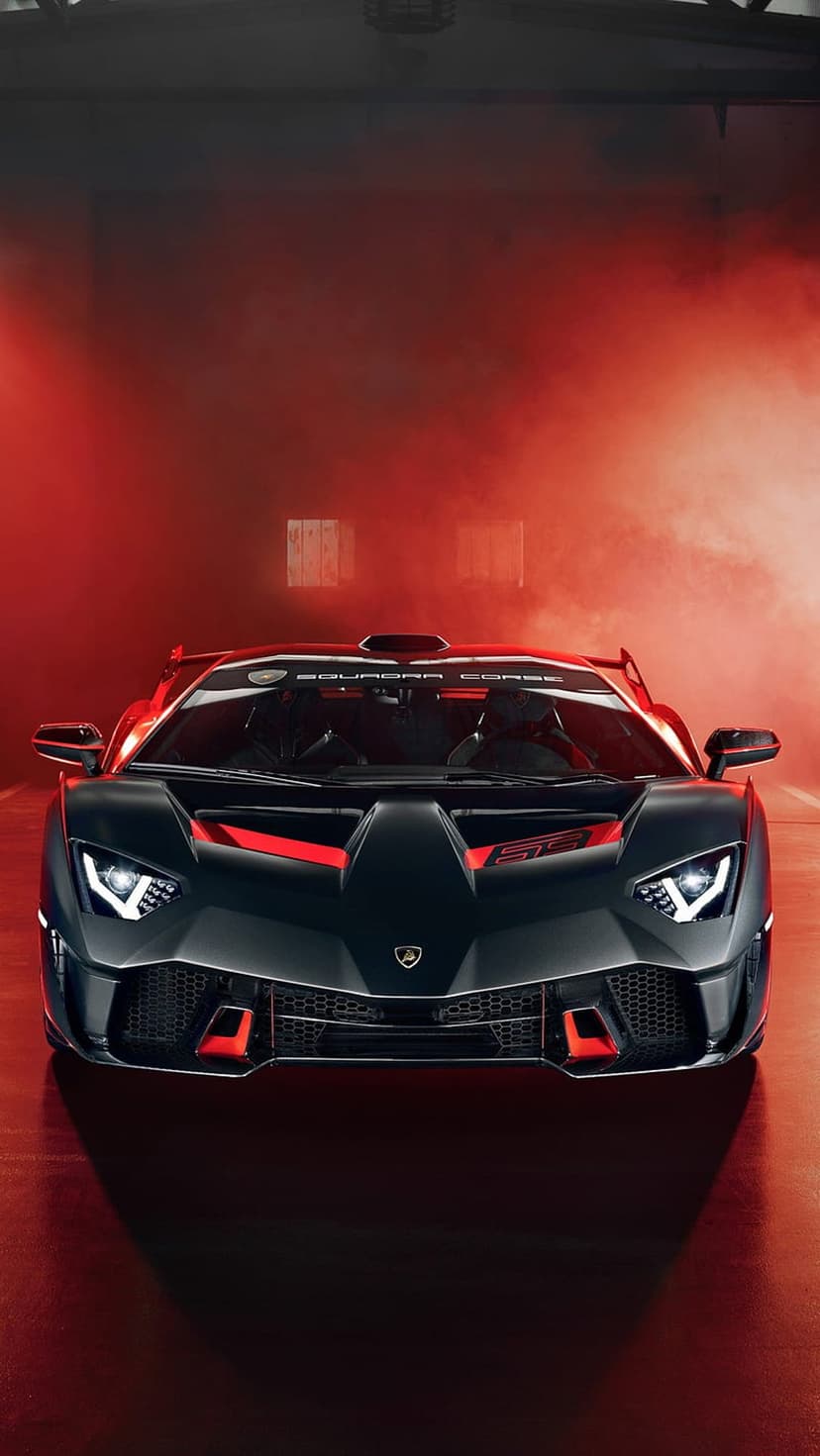 Black Lamborghini Centenario Roadster front view surrounded by thick red smoke in a dark vertical composition.