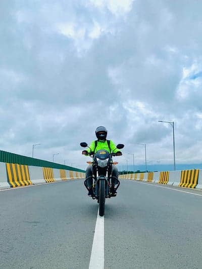 Biker Riding Through Stormy Skies Cinematic Phone Wallpaper