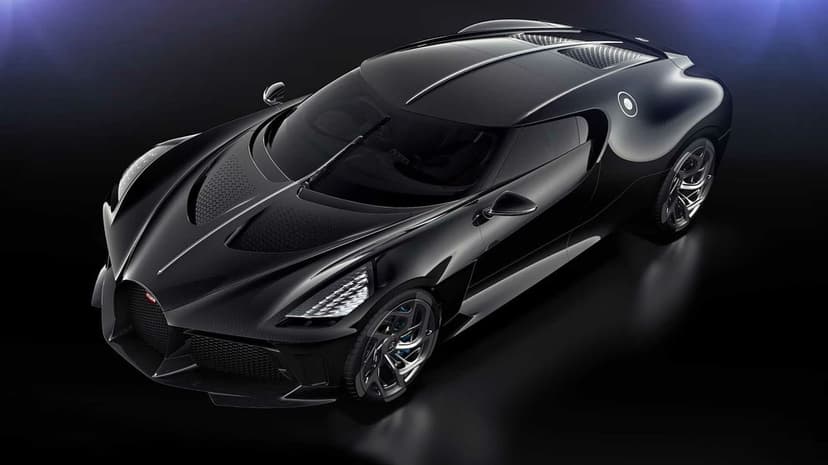 Black Bugatti La Voiture Noire hypercar with visible carbon fiber texture on a dark studio background.