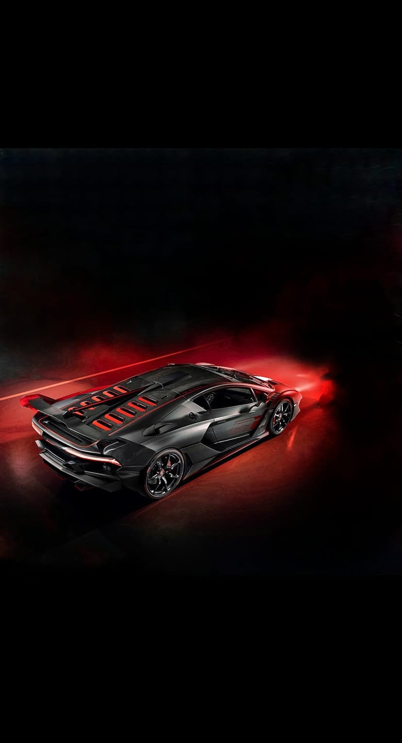 Matte black Lamborghini hypercar with glowing red taillights and vents viewed from a low-angle perspective.
