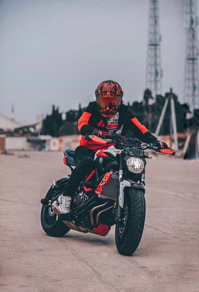 Orange and Black Yamaha Sportbike Rider Mobile Wallpaper