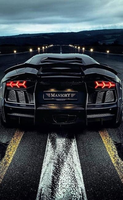 Mansory Aventador: Black supercar on a runway at night