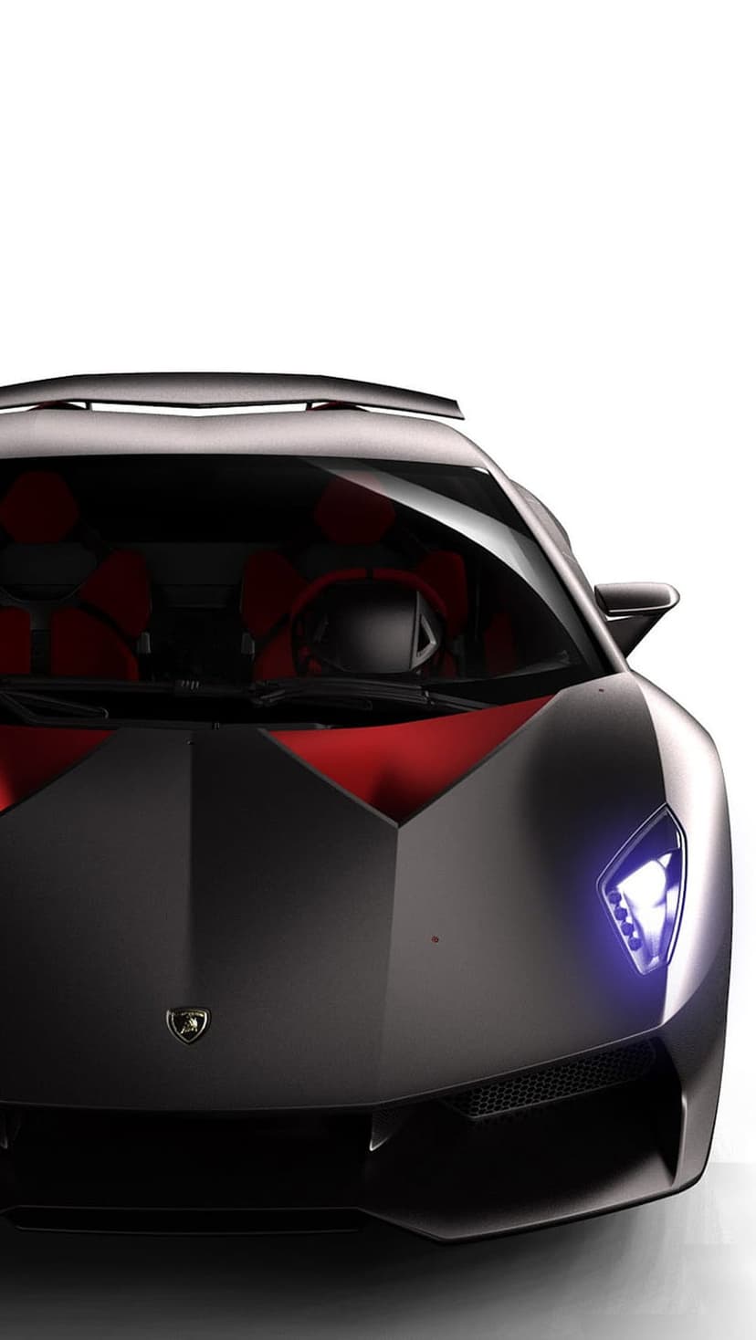 Matte black Lamborghini supercar showing a red leather interior and glowing blue headlights in a low-angle view.