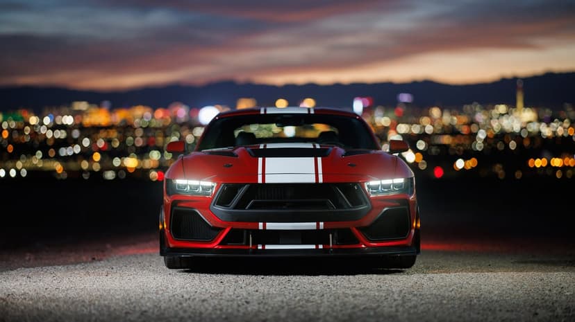 Shelby Super Snake muscle car showcasing metallic finish, carbon fiber hood vents, and sleek aerodynamic body.