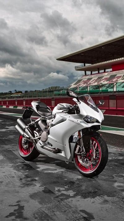 White Ducati Panigale Motorcycle on Racetrack