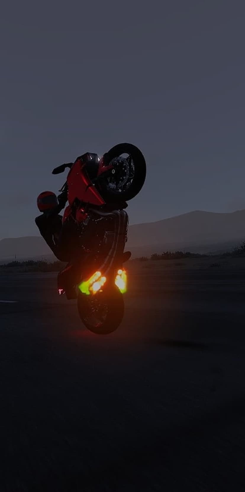 Red motorcycle performing a wheelie with orange and green neon underglow against a twilight sky and distant hills.