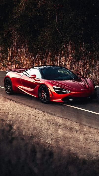 Red McLaren 720S Sports Car on Scenic Road