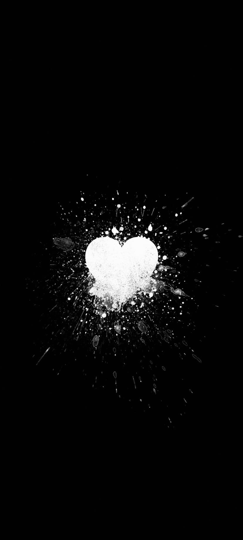 White heart-shaped paint splatter with fine droplets radiating outward against a solid black background.
