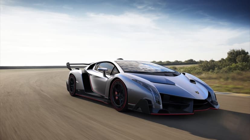 Lamborghini Veneno supercar side profile showing silver metallic finish and aerodynamic carbon fiber body panels.