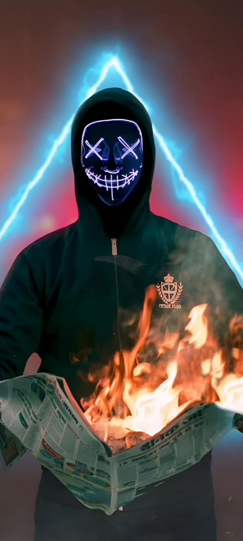 Hooded figure in a glowing blue X-eyed mask holds a flaming newspaper amidst electric lightning strikes.