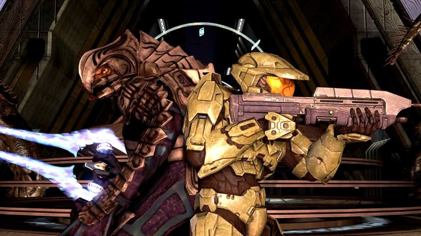 Master Chief with an assault rifle and Arbiter with an energy sword stand back-to-back in a Forerunner hall.