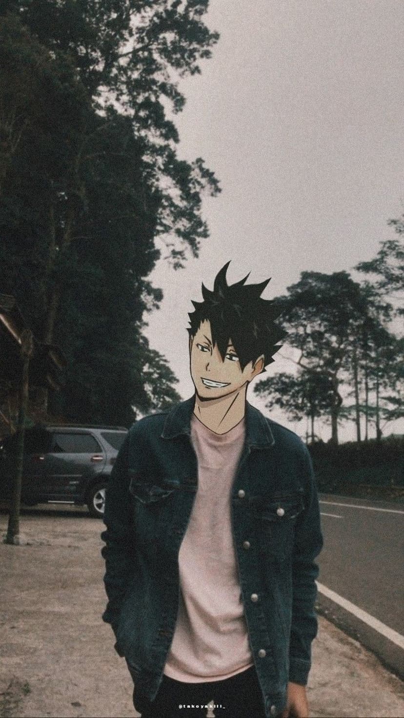 Anime character with black spiky hair and a denim jacket smiles confidently on a roadside with trees behind him.