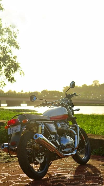 Red Royal Enfield Interceptor 650 Sunset River Wallpaper
