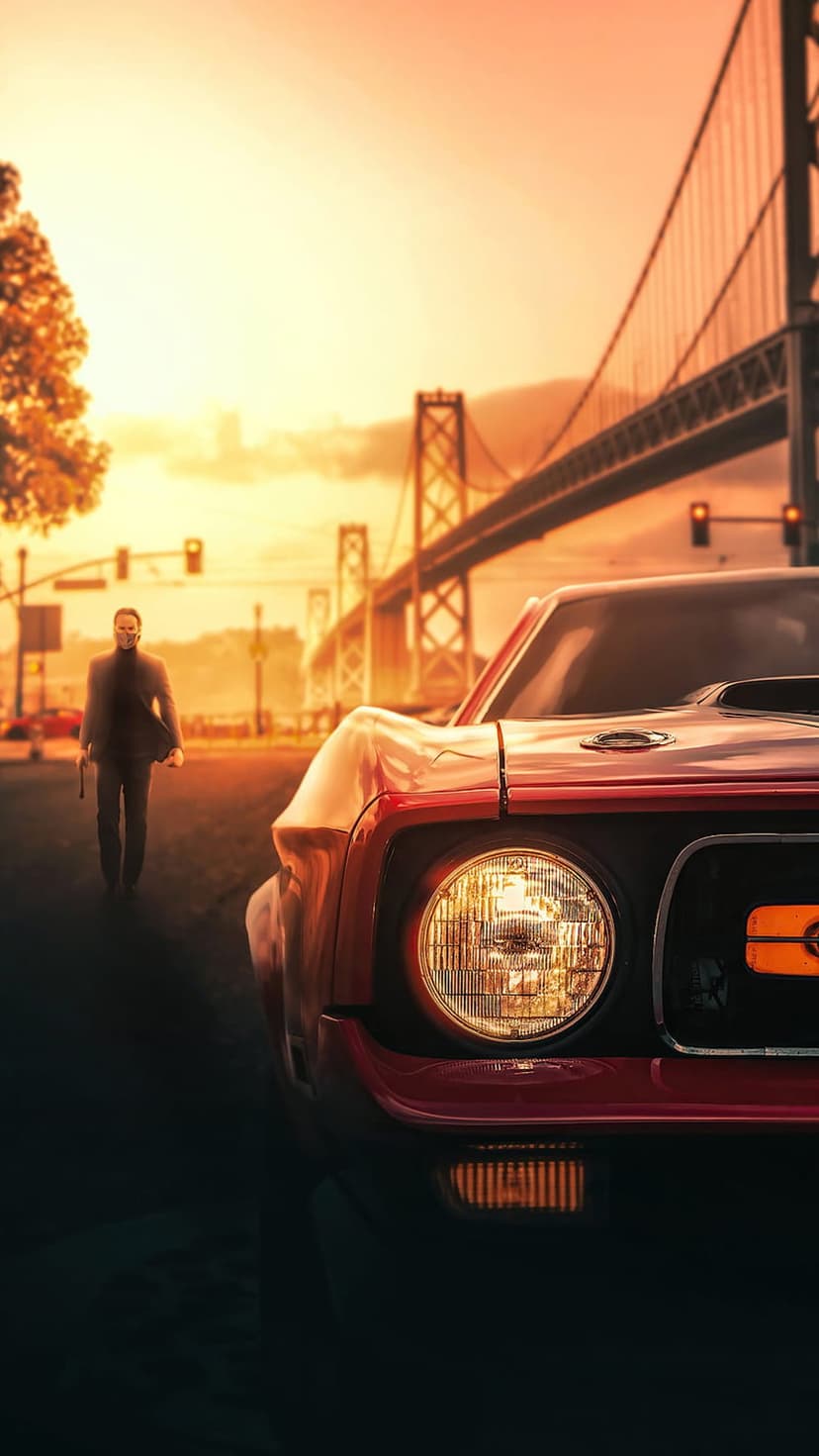 Man in a dark suit walking past a red vintage car on a road with a large suspension bridge during sunset.