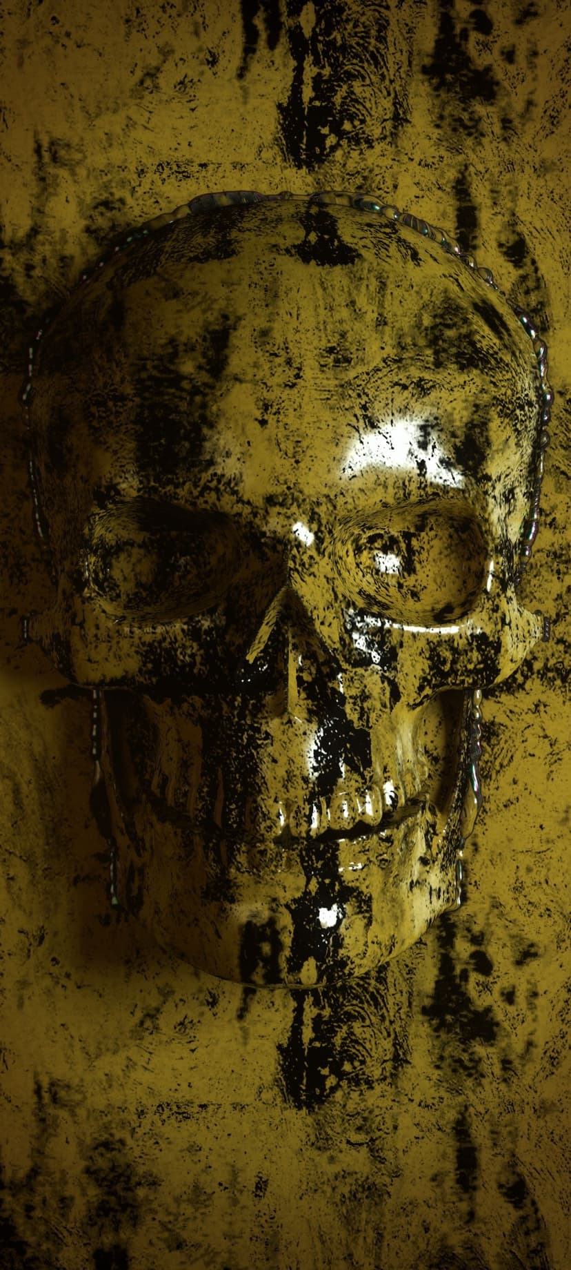 Golden skull with a weathered black textured overlay against a dark background, showing intricate metallic details.