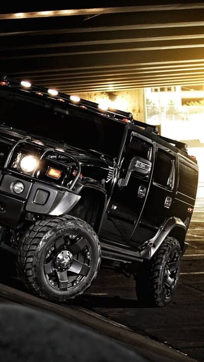 Black Hummer H2 tire and undercarriage detail