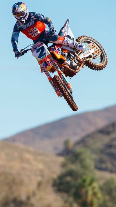 Professional Motocross Rider Jump Phone Background
