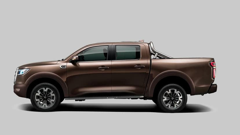 Sleek brown metallic pickup truck profile view with chrome roll bars on a solid gray studio background.