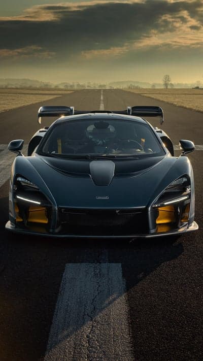 Dark McLaren Senna Supercar on Runway Mobile Wallpaper