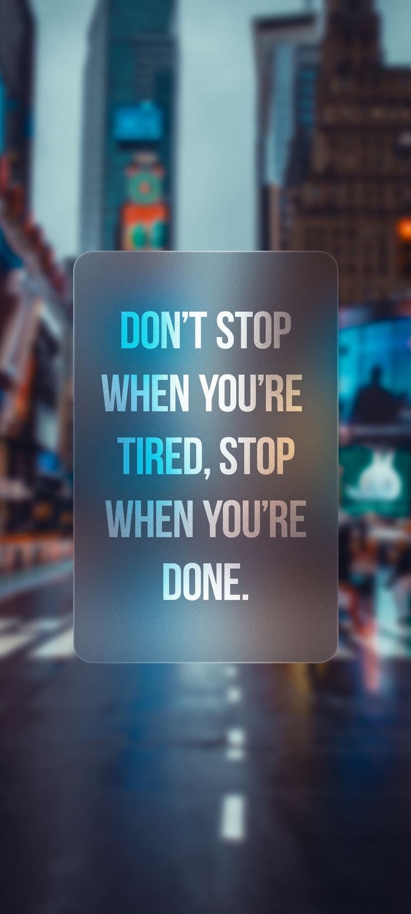 White sans-serif motivational text centers over a soft bokeh background of glowing city lights at twilight.