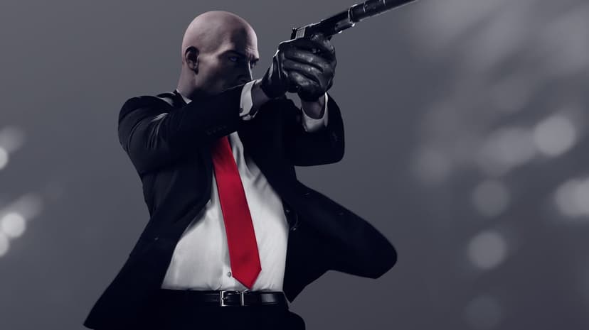Agent 47 in a black suit and red tie aims a suppressed pistol against a gray background with bokeh lights.