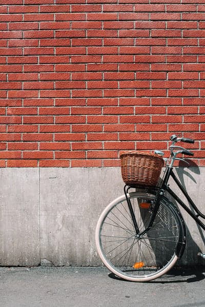 Retro Bicycle with Wicker Basket Red Brick Wallpaper