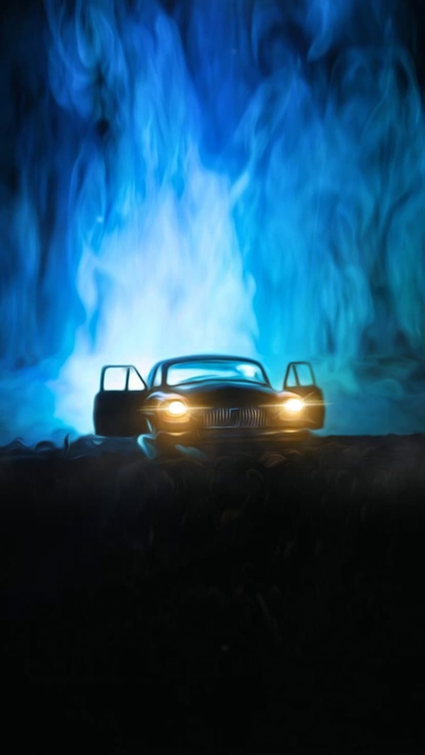 Vintage car with glowing headlights and an open door surrounded by thick swirling blue smoke at night.