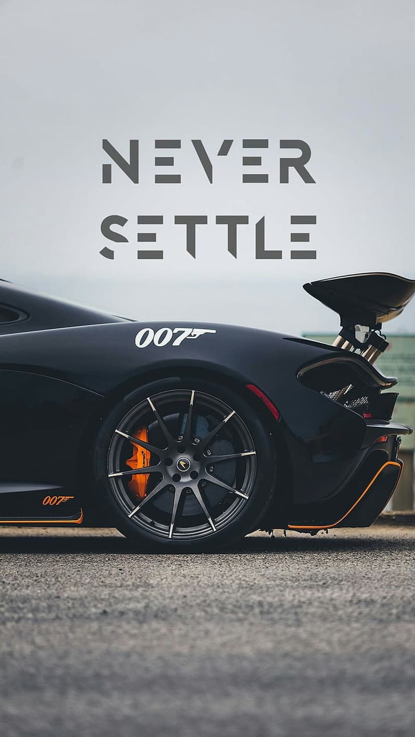 McLaren P1 rear wheel and spoiler with 007 logo and Never Settle text on a minimalist dark background.