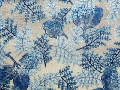 Blue Fern and Leaf Pattern on Textured Beige Fabric