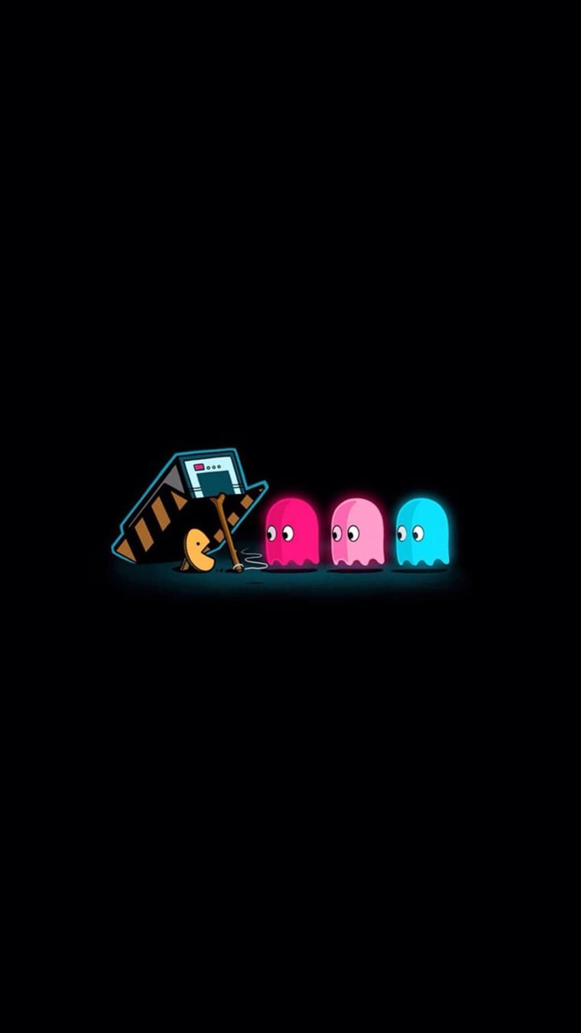 Pac-Man hides behind a construction sign tricking pink and blue ghosts with a fake yellow power pellet.