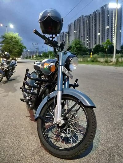 Royal Enfield motorcycle with helmet parked roadside