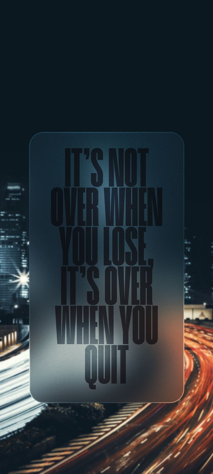 Inspirational quote text centered on a dark city street featuring vibrant yellow and orange bokeh light streaks.