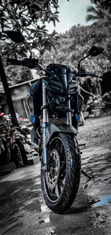 Wet Yamaha MT-15 Motorcycle on Rainy Day