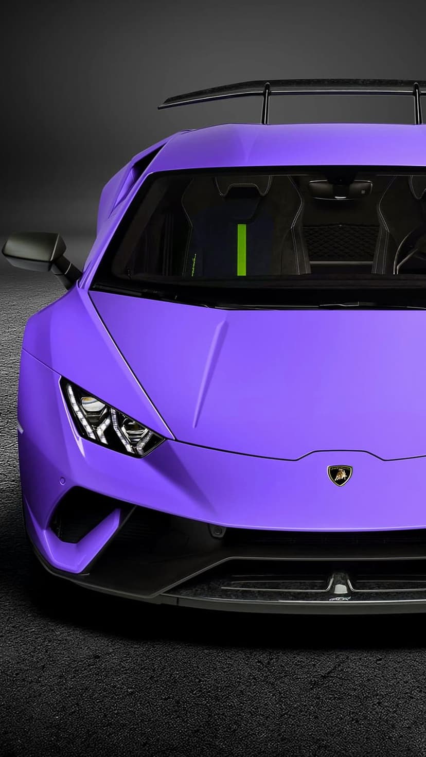 Purple Lamborghini Huracan showing sharp headlights and green racing seats against a dark textured background.