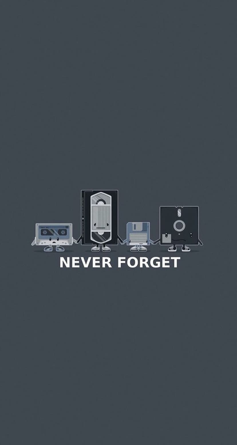 Cassette, VHS tape, floppy disk, and CD with tiny feet holding hands above Never Forget text on dark grey.