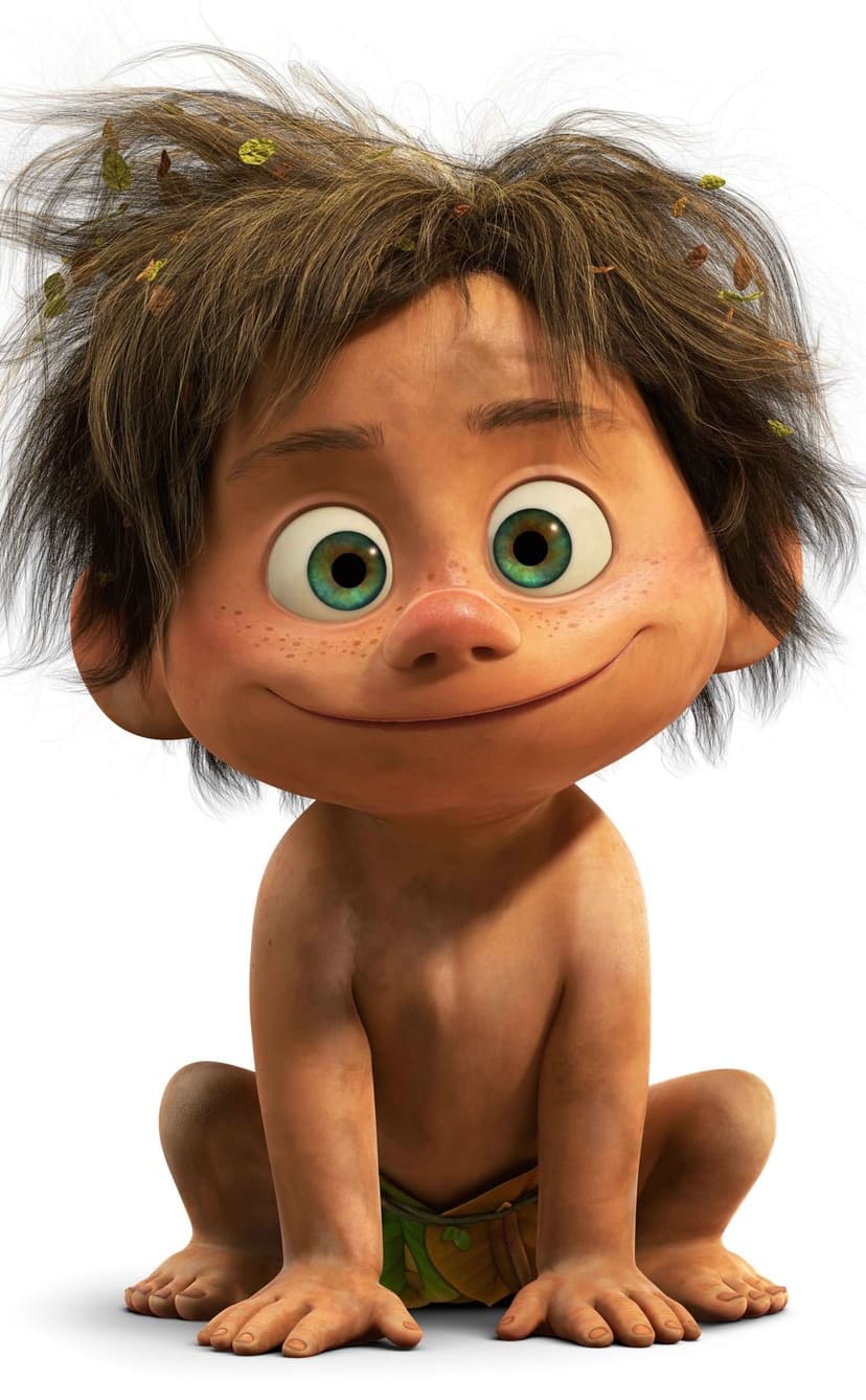 Arlo from The Good Dinosaur has messy brown hair with leaves and bright green eyes while smiling innocently.