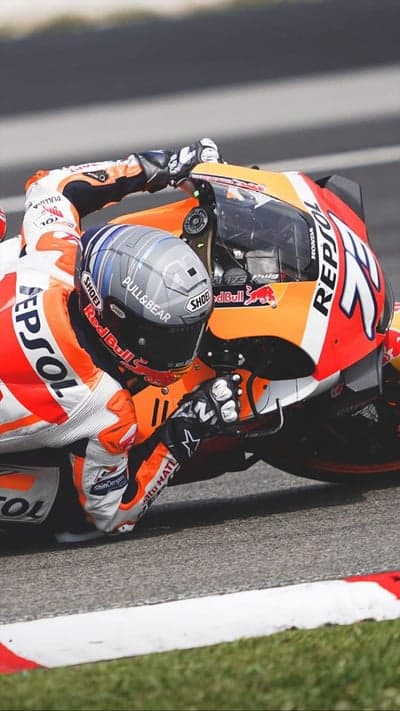 MotoGP Rider Leans Deep into Corner on Honda Repsol Bike