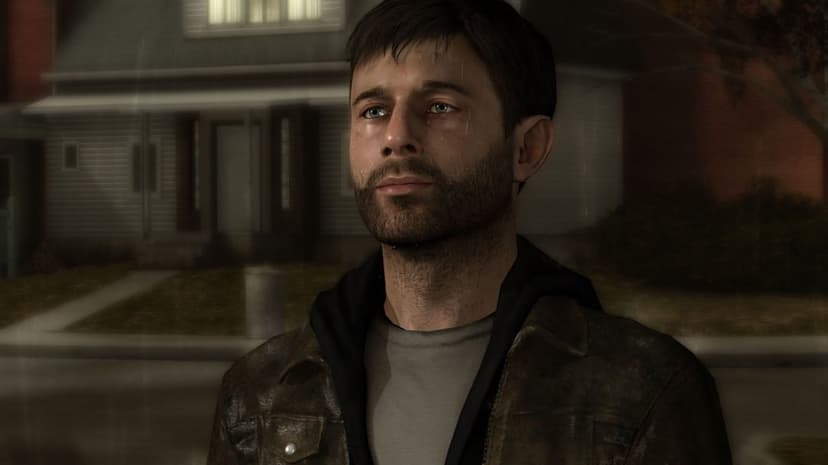Man with a beard in a leather jacket stands in the rain at night in front of a suburban house.