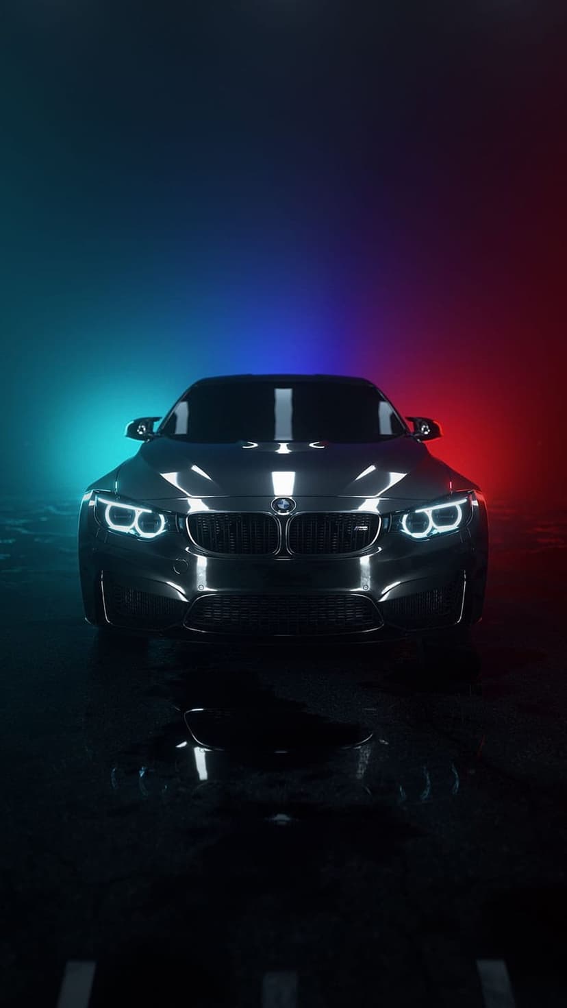 BMW M4 sports car illuminated by red and blue neon lights with reflections on a wet ground at night.