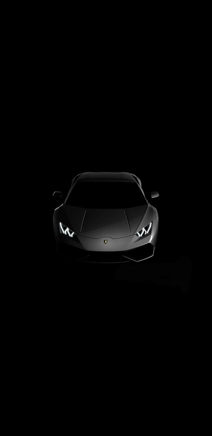 Black Lamborghini supercar with glowing LED headlights and sharp aerodynamic lines against a dark background.