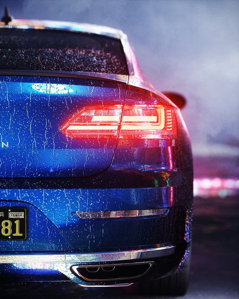 Rear of a blue car features glowing red taillights and water droplets on its surface during a rainy city night.