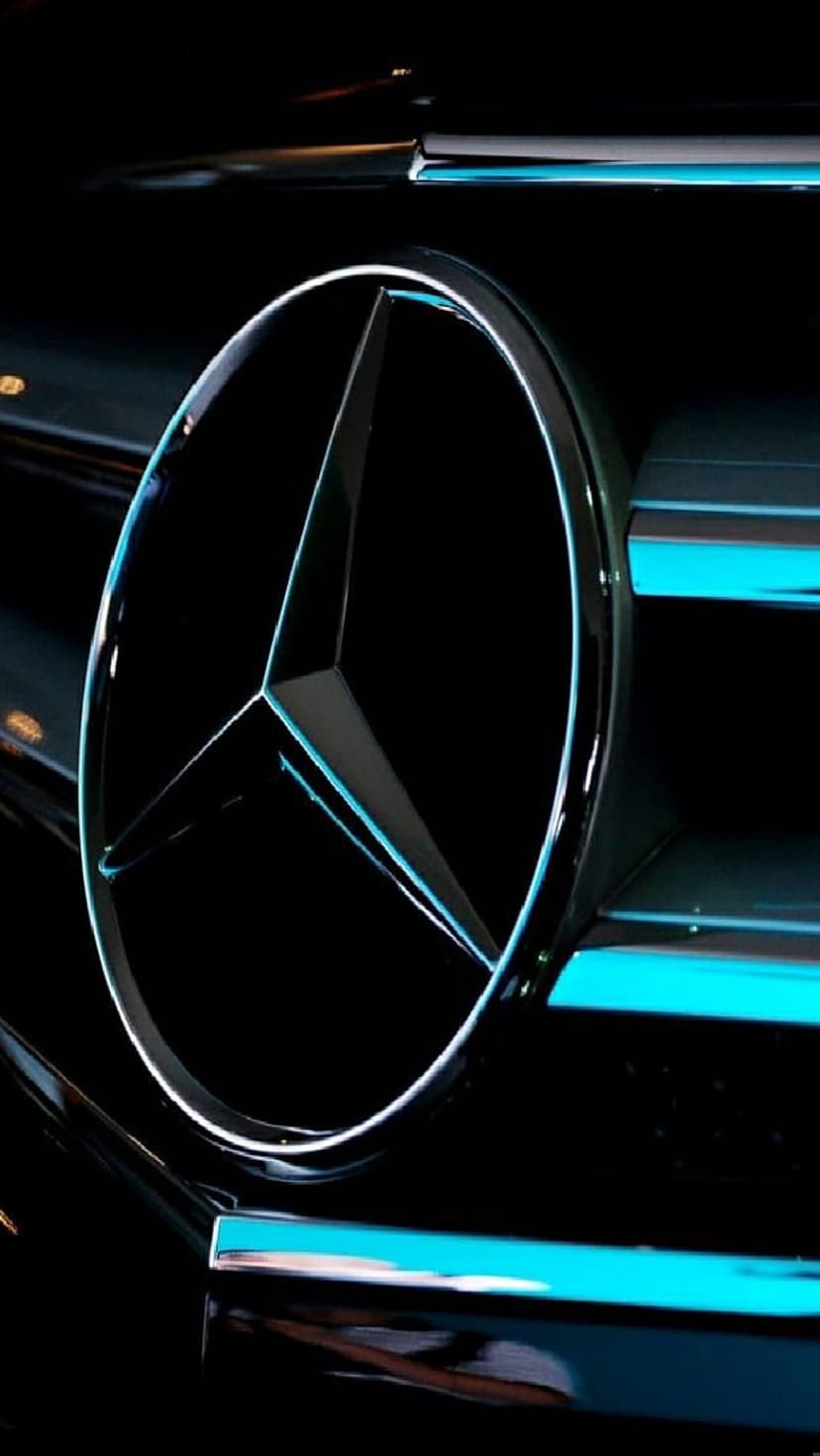 Mercedes-Benz emblem with a glowing blue neon outline centered on a dark honeycomb car grille background.
