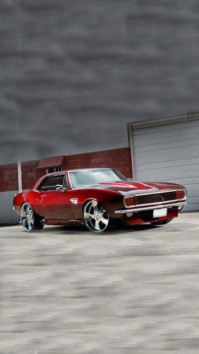 Custom Red 1967 Chevrolet Camaro with Chrome Rims