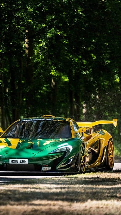 Green and Yellow McLaren P1 Race Car in Forest