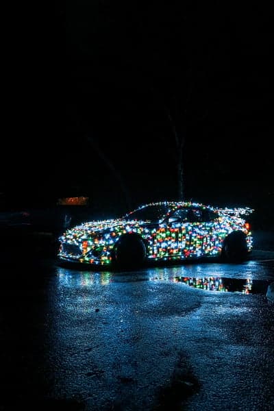 Car Decorated with Colorful Christmas Lights at Night