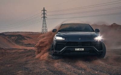 Dark Lamborghini Urus SUV Desert Drift Desktop Background