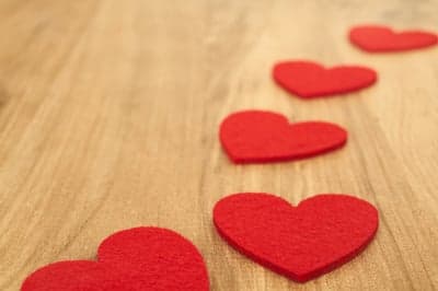 Red Hearts on Wooden Surface - Valentine's Day Background