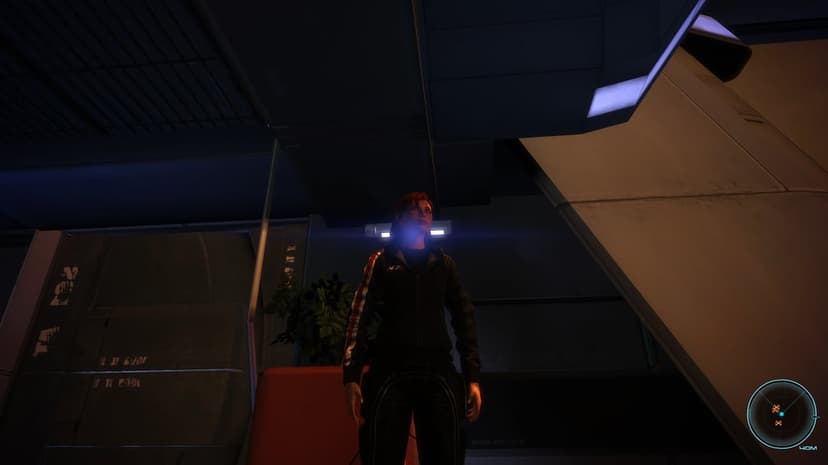 Female Commander Shepard wearing an N7 hoodie inside a dark futuristic spaceship with a bright blue lens flare.